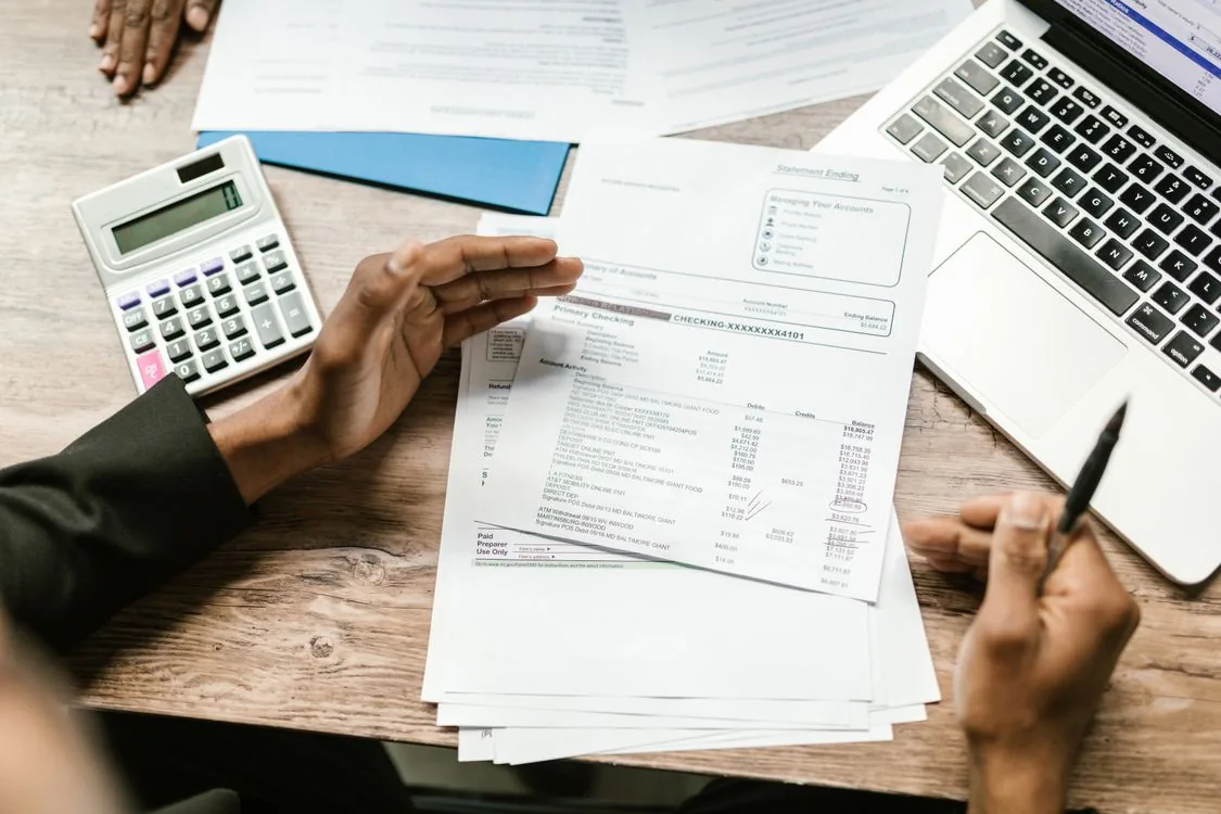 Financial documents and calculator on a desk